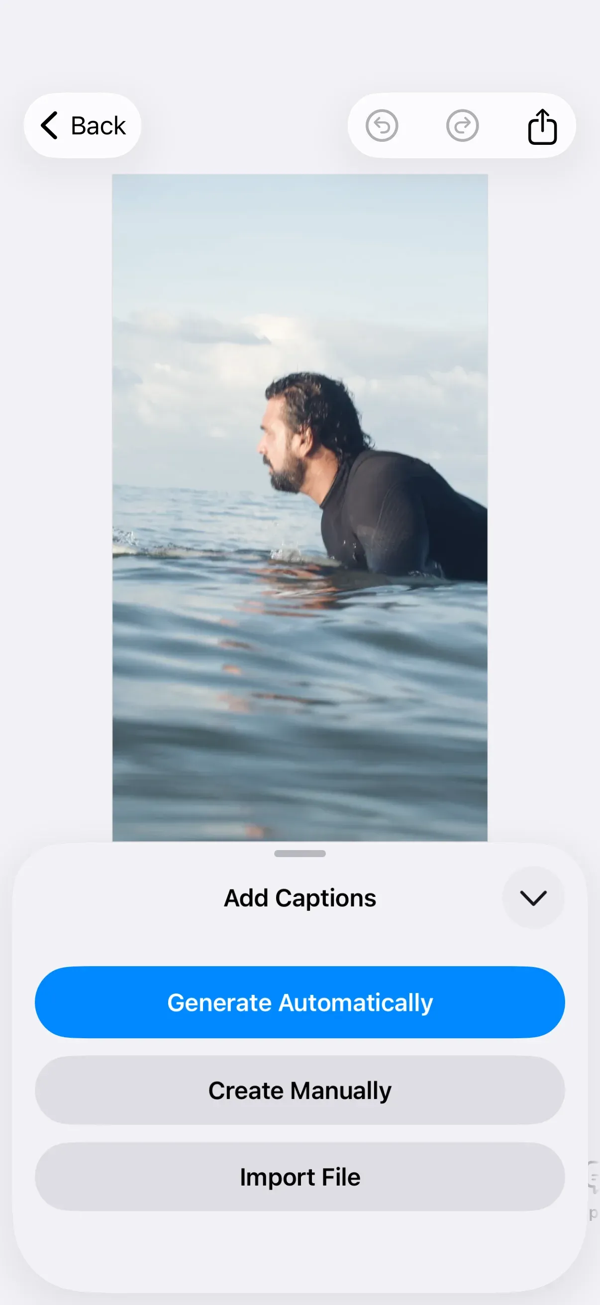 CE.SDK iOS video editor showing the Add Captions sheet with the Generate Automatically action