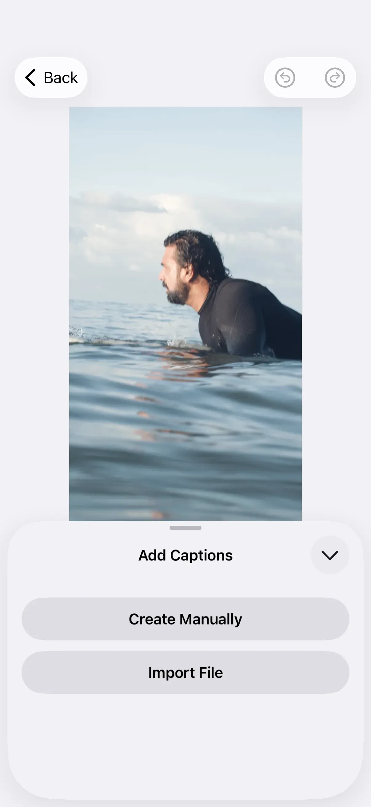 CE.SDK iOS video editor presenting the Add Captions sheet over the canvas